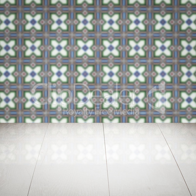 Wood table top and blur vintage ceramic tile pattern wall