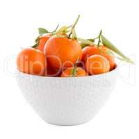 Tangerines on ceramic white bowl