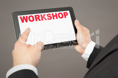 business man pointing to a tablet pc