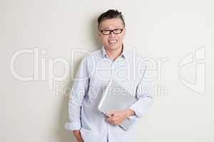 Mature Asian man and information technology concept
