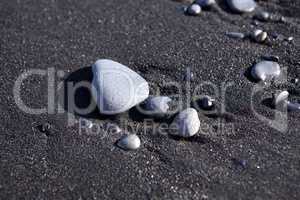 Stones at a black sand beach