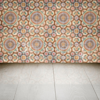 Wood table top and blur vintage ceramic tile pattern wall