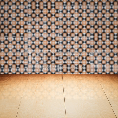 Wood table top and blur vintage ceramic tile pattern wall Wood table top and blur vintage ceramic tile pattern wall