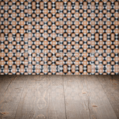 Wood table top and blur vintage ceramic tile pattern wall