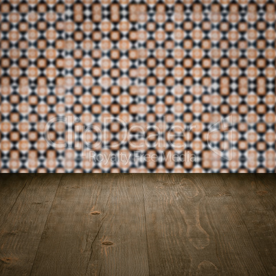 Wood table top and blur vintage ceramic tile pattern wall