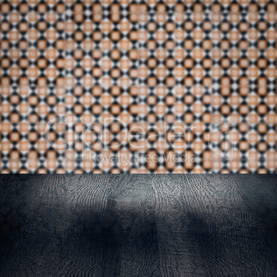 Wood table top and blur vintage ceramic tile pattern wall