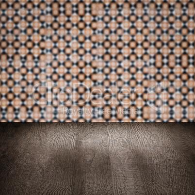 Wood table top and blur vintage ceramic tile pattern wall