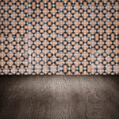 Wood table top and blur vintage ceramic tile pattern wall