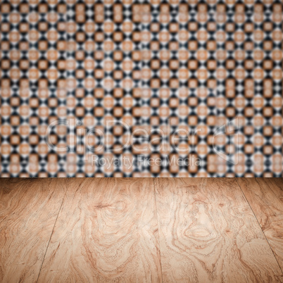 Wood table top and blur vintage ceramic tile pattern wall