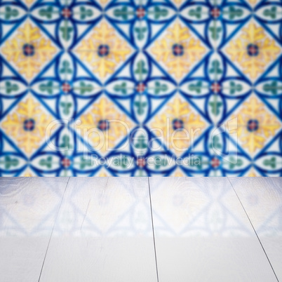 Wood table top and blur vintage ceramic tile pattern wall