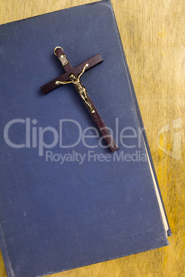 Catholic cross on the book