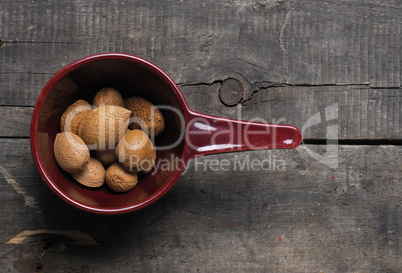 Almonds in a red bowl