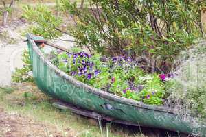 Abandoned boat decorated with flowers
