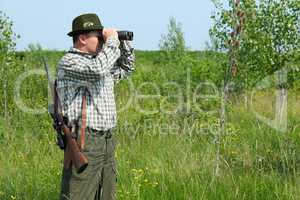 hunter with binoculars looking for venison