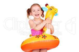 happy little girl with inflatable rubber ready for beach