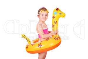 little girl with inflatable rubber and goggles