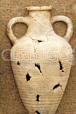 The souvenir imitating an ancient amphora from clay.