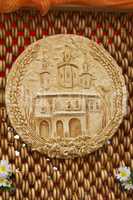 Bread, decorated with the image of the temple, is situated on th