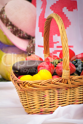 The beautiful basket with vegetables, fruit is on sale at fair.