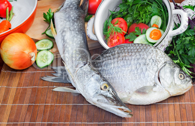 Fish and components for her preparation: vegetables, spices, par