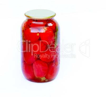 Canned tomatoes in a large glass jar on white background