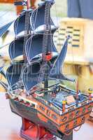 The model of a sailing vessel is photographed by a close up