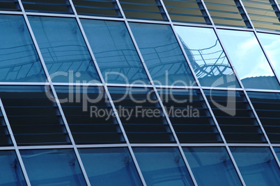 Reflection in windows of modern office building - part of modern