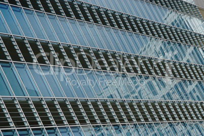 Reflection in windows of modern office building - part of modern