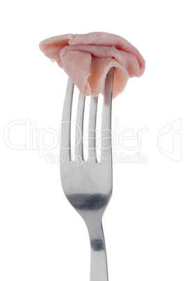 Slice of ham skewered on a fork