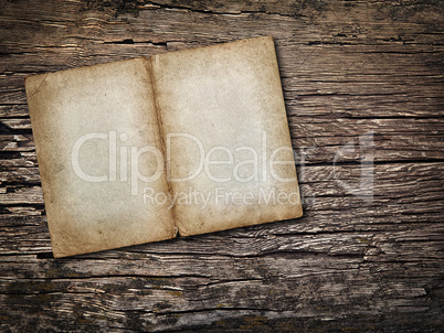 Old sheet of paper on vintage wooden background