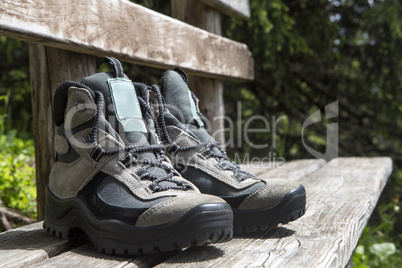 Grey hiking shoes on a bench