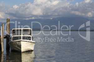 Motor boat at the pier, Chiemsee, Bavaria