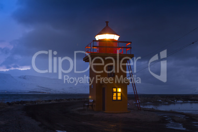 Orange lighthouse at night, Iceland