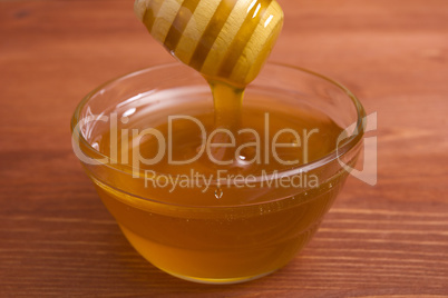 Wooden honey stick to extract honey