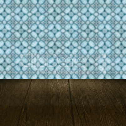 Wood table top and blur vintage ceramic tile pattern wall Wood table top and blur vintage ceramic tile pattern wall