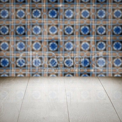 Wood table top and blur vintage ceramic tile pattern wall