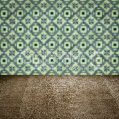 Wood table top and blur vintage ceramic tile pattern wall