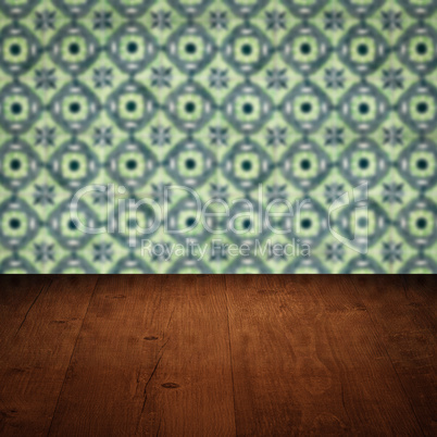 Wood table top and blur vintage ceramic tile pattern wall