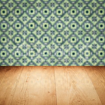 Wood table top and blur vintage ceramic tile pattern wall