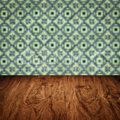 Wood table top and blur vintage ceramic tile pattern wall
