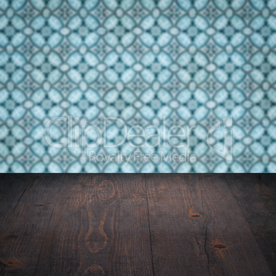 Wood table top and blur vintage ceramic tile pattern wall