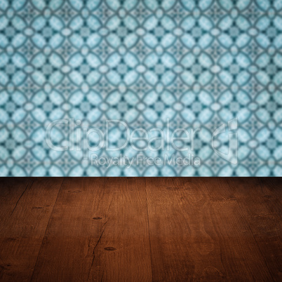 Wood table top and blur vintage ceramic tile pattern wall