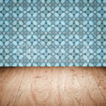 Wood table top and blur vintage ceramic tile pattern wall