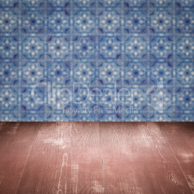 Wood table top and blur vintage ceramic tile pattern wall