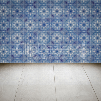 Wood table top and blur vintage ceramic tile pattern wall