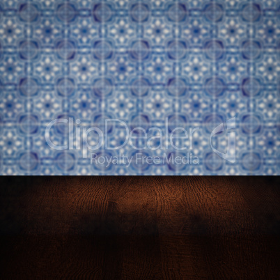 Wood table top and blur vintage ceramic tile pattern wall