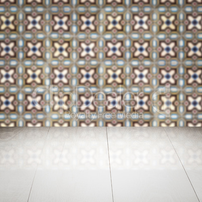 Wood table top and blur vintage ceramic tile pattern wall