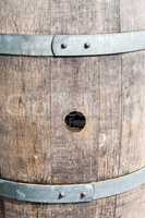 Bung hole in old wood barrel between bands