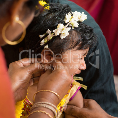 Traditional Hindu having ear piercing ceremony