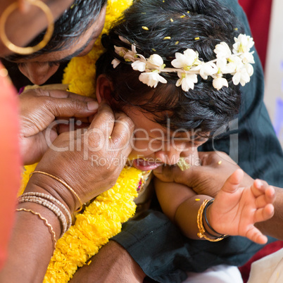 Traditional Indian Hindu family ear piercing ceremony